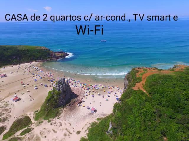 CASA completa em TORRES-RS - O MELHOR CUSTO BENEFICIO na mais bela praia Gaúcha - Cozinha - Banheiro - Ar condicionado - Smart TV 32 Android Apps Youtube - Netflix - Prime Vídeo e Wi-Fi - Estacionamento - Acomoda até 10 pessoas - Anfitriã Superhost n Villa Esterno foto